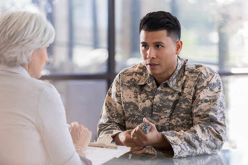 Veteran discusses disability claim with claims expert