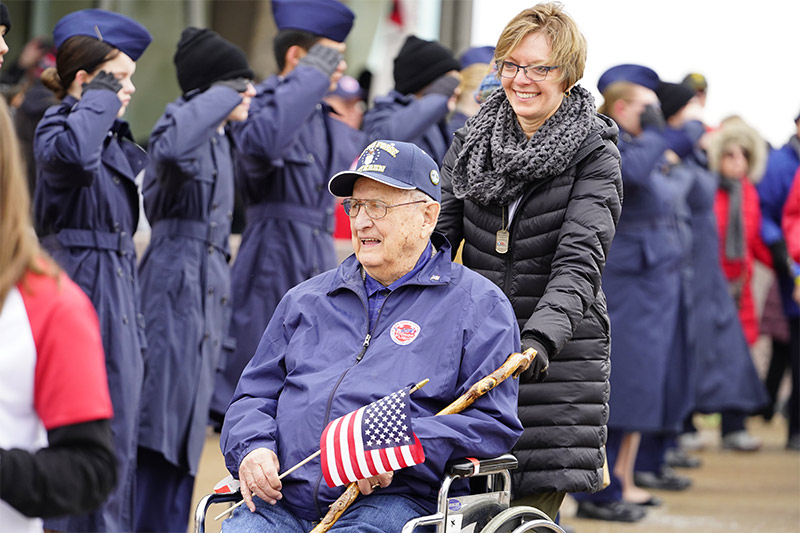 Disabled World War II veteran participating in memorial ceremony